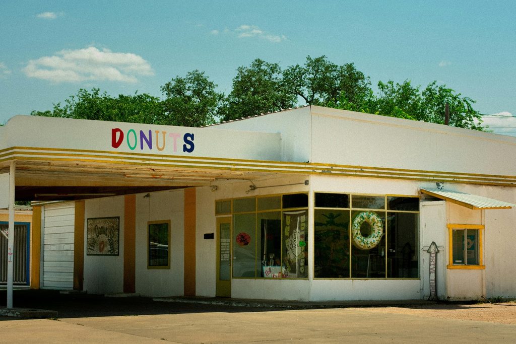 Front view of an old donuts store, in a small town