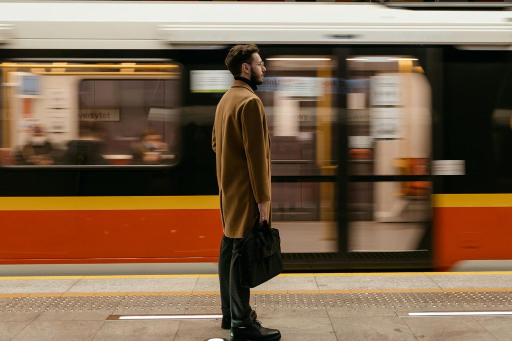 Man waiting on the train to stop