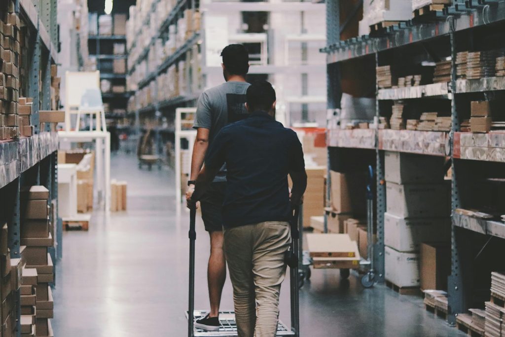 Two people walking through a home supply store