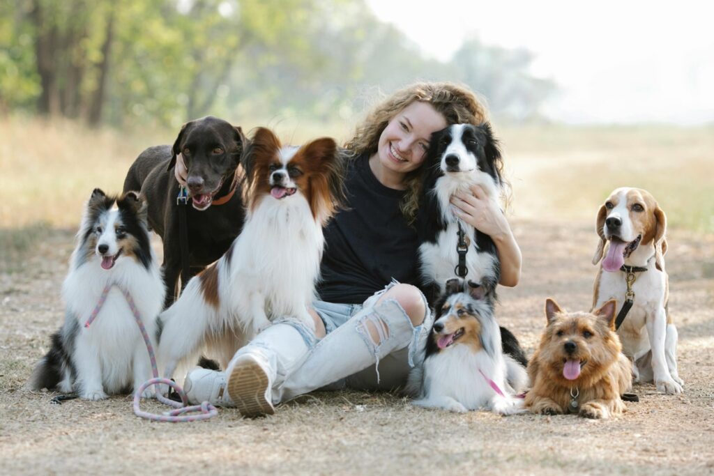 Woman with several dogs
