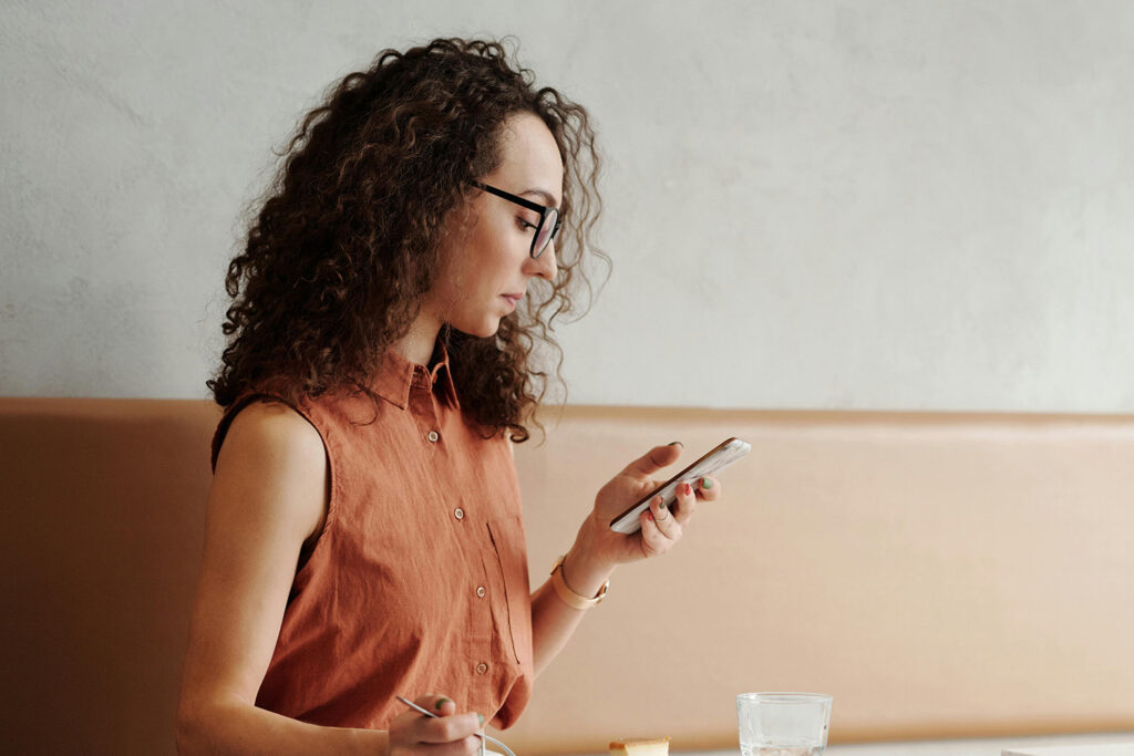 Young woman checking her phone