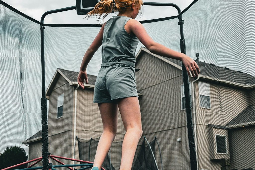A girl jumping on a trampoline