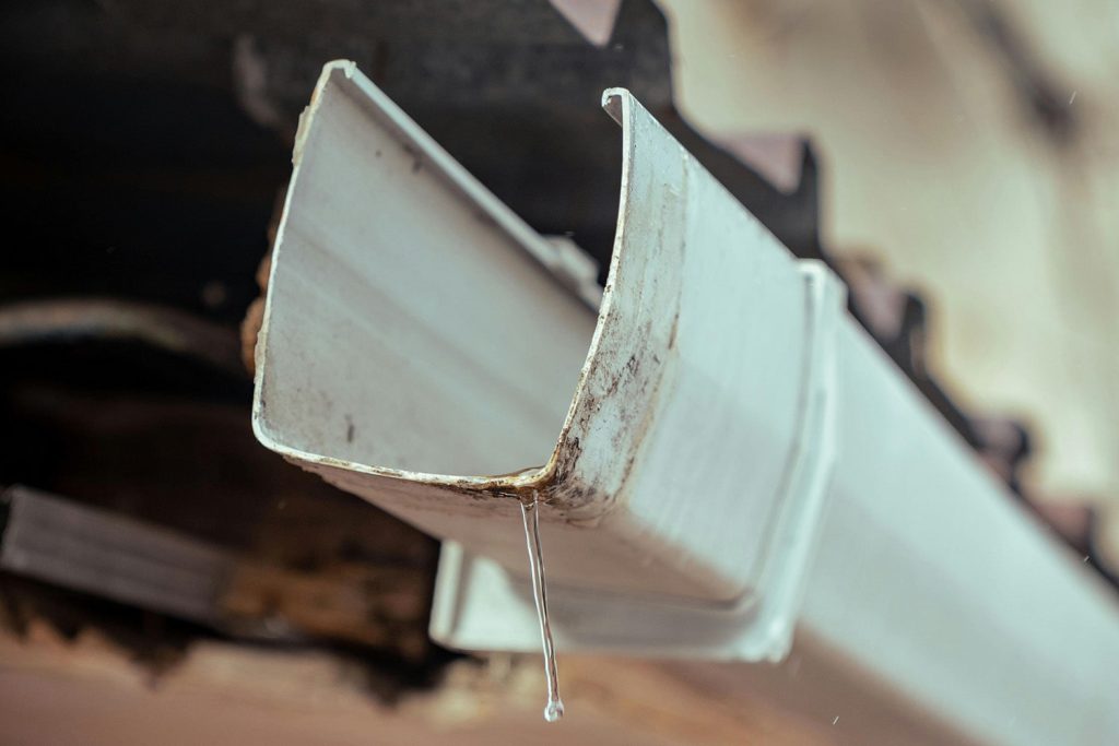A side view of a gutter, gutter cleaning