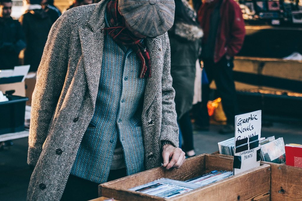 Man looking at stuff in a garage